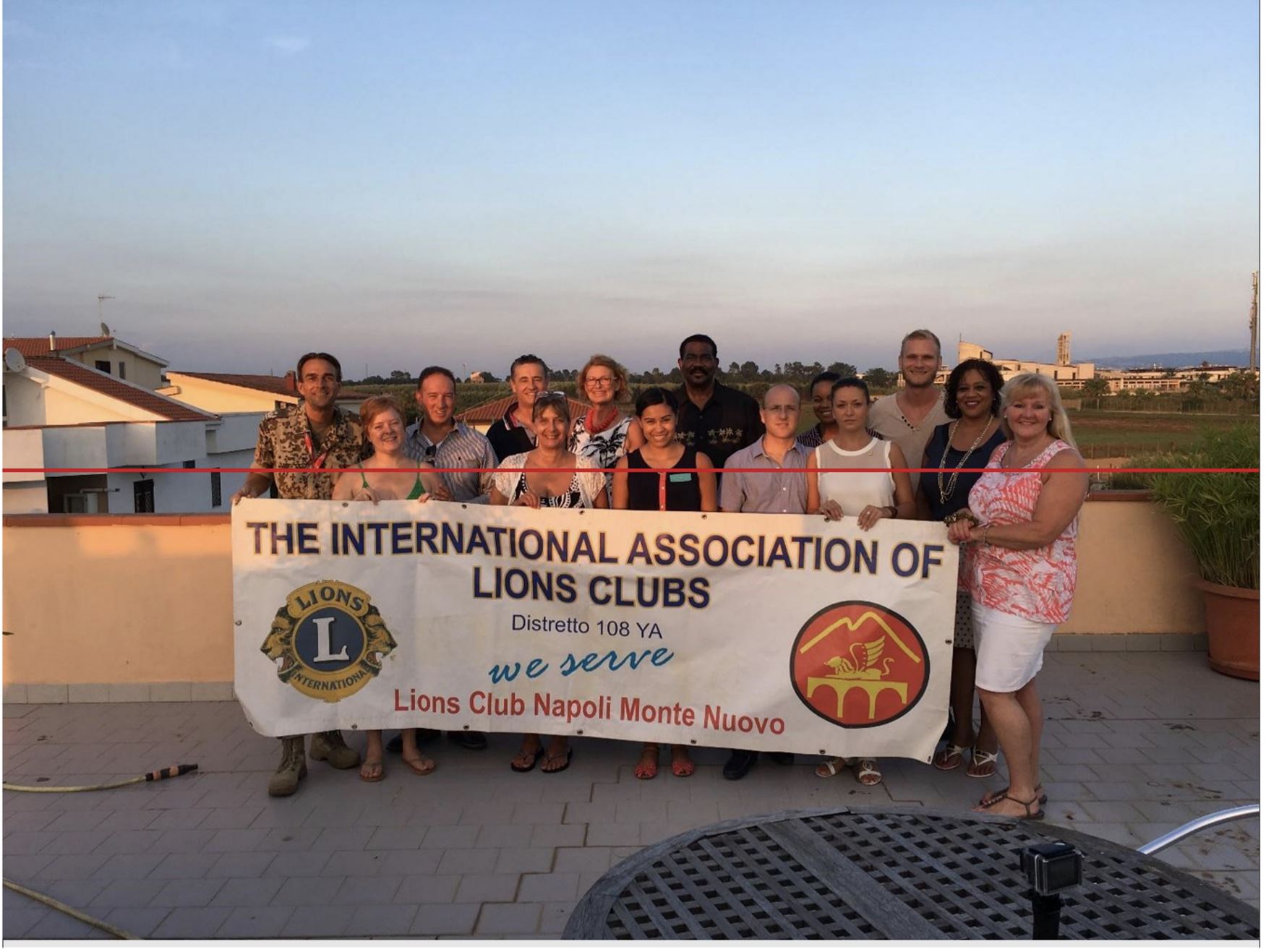 Photo of the NATO-associated branch of the Lions Club. “Maria Adela,” fourth from right